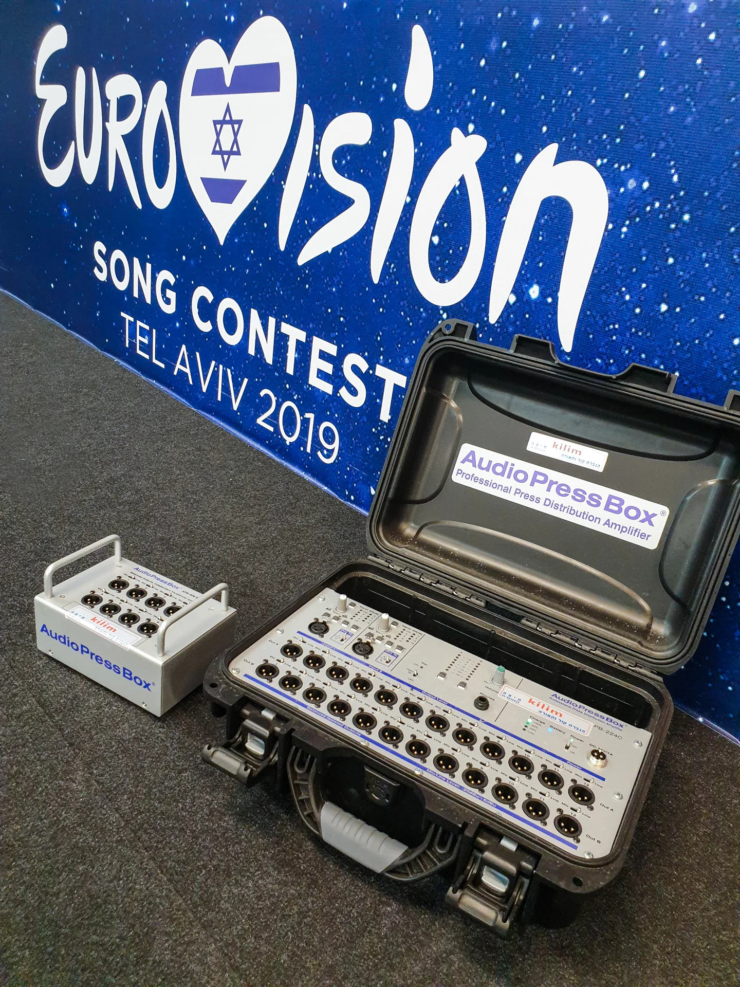 Eurovision song contest - AudioPressBox APB-008 SB-EX and APB-224-C with connected microphones and cables — on-site media setup