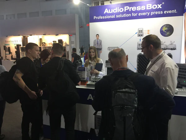 Prolight+sound 2017 in Frankfurt - AudioPressBox trade show booth demonstration — visitors discussing press box audio distribution
