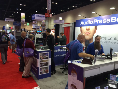Infocomm 2012, Las Vegas - AudioPressBox trade show booth demonstration — visitors discussing press box audio distribution