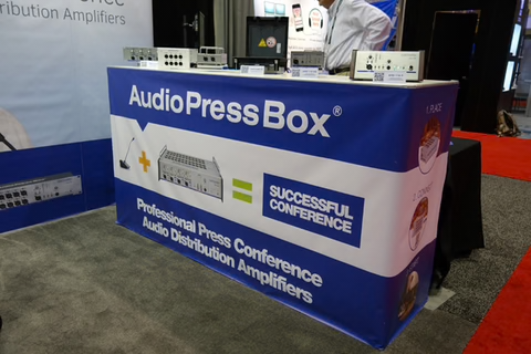 Infocomm 2015, Orlando- AudioPressBox presentation at a trade show booth with press boxes prepared for live demonstrations.