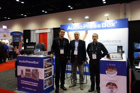 Infocomm 2015, Orlando- AudioPressBox team at trade show booth — press boxes on display for media audio distribution