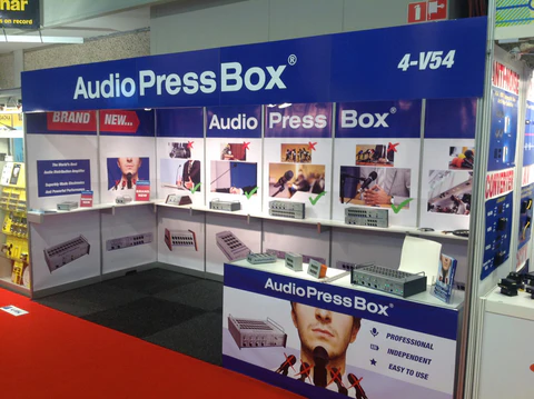 ISE 2014 - AudioPressBox trade show booth demonstration — visitors discussing press box audio distribution