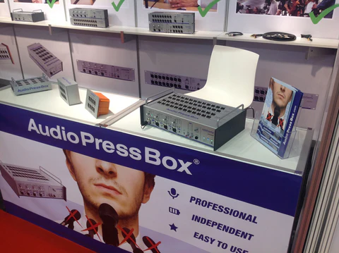 ISE 2014 - AudioPressBox trade show booth demonstration — visitors discussing press box audio distribution