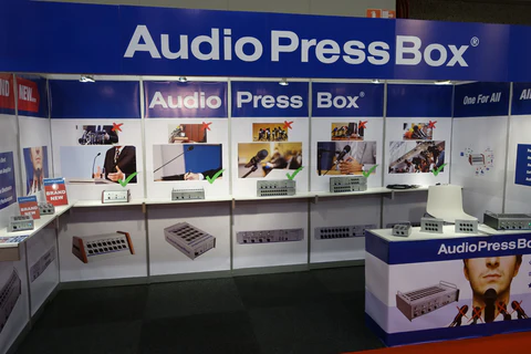 ISE 2014 - AudioPressBox trade show booth demonstration — visitors discussing press box audio distribution