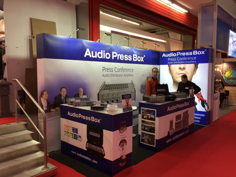 ISE 2016 Amsterdam - AudioPressBox trade show booth demonstration — visitors discussing press box audio distribution