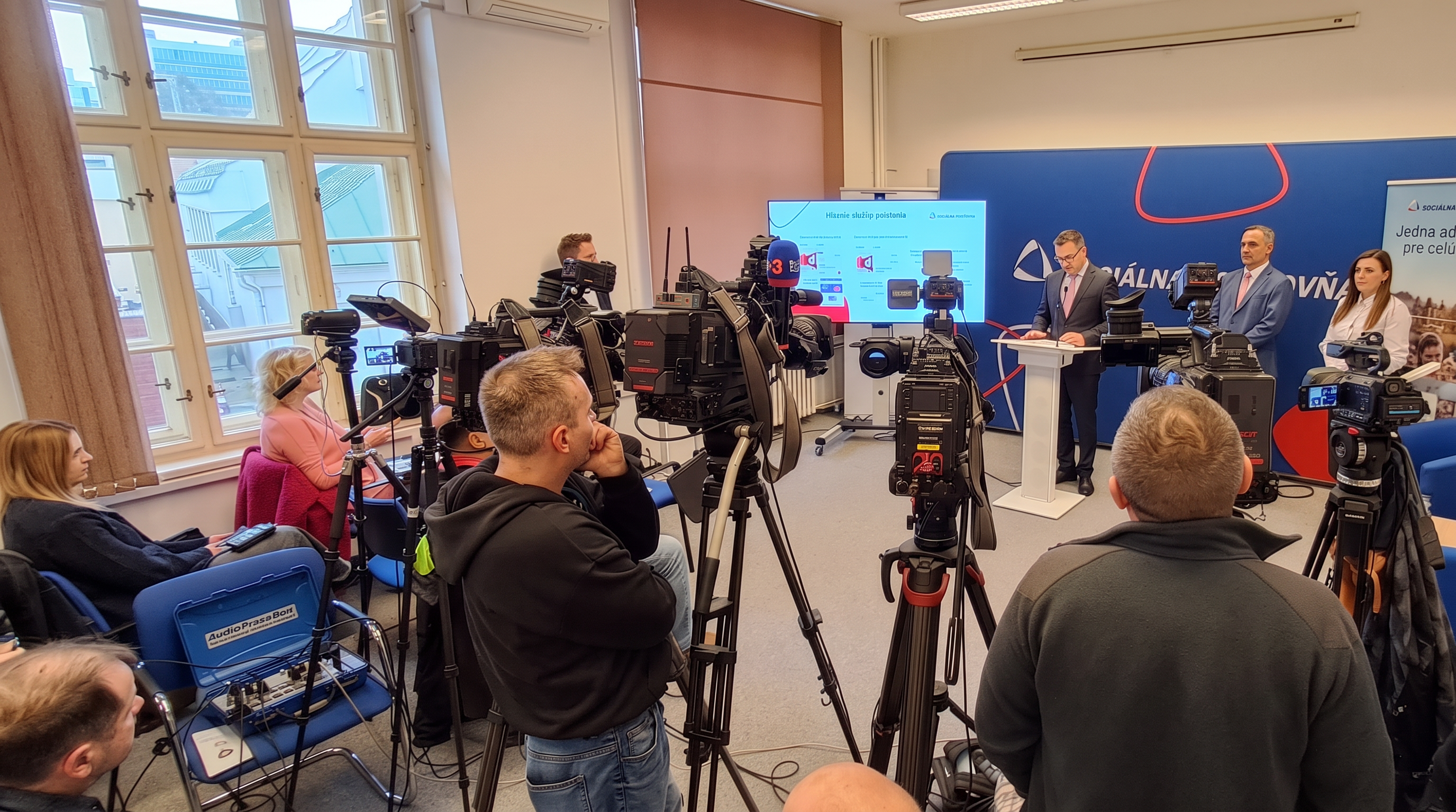 Press conference of the ministry — cameras and journalists, AudioPressBox used for media audio distribution