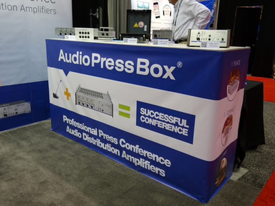 Infocomm 2015, Orlando- AudioPressBox presentation at a trade show booth with press boxes prepared for live demonstrations.